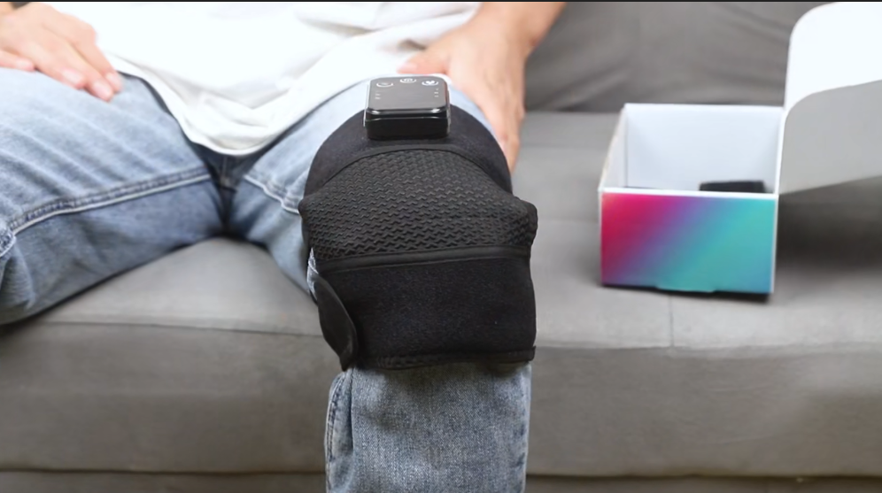 MotionNest customer wearing the knee massager